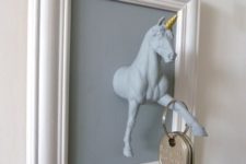 05 a unicorn key holder in a frame is a fun idea for any entryway