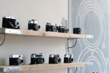06 simple wooden shelves won’t distract attention from your precious cameras