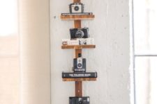 07 a vertical wooden shelf to display each camera individually and with style