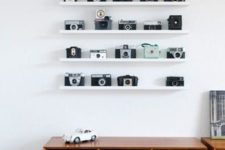 16 white ledges by IKEA are ideal for displaying vintage cameras and won’t distract attention from them