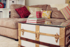 DIY vintage trunk turned into a coffee table with a glass top