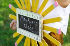 DIY pencil wreath of paint stirrers with a chalkboard