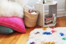 DIY shag rug of neutral and colorful yarn