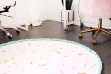 DIY washable confetti rug with pompom trim