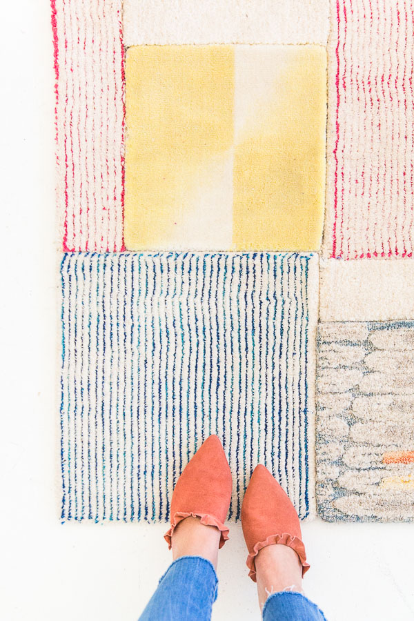 DIY large-scale rug of colorful carpet samples (via www.papernstitchblog.com)