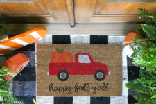 DIY fall doormat with a van full of pumpkins