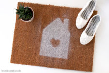 DIY neutral doormat with a white house with a heart