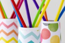 DIY yogurt cup pencil holder spruced up with colorful paper