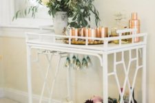 08 a bar cart with gorgeous fall floral arrangements, white pumpkins in a bowl and copper barware