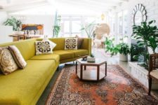 08 a large sculptural mustard sofa is ideal for a boho space and looks very bold