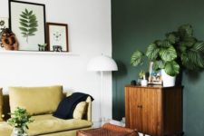dark green accent wall in a white room