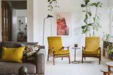 16 mid-century modern mustard chairs and a matching pillow to infuse the living room with color
