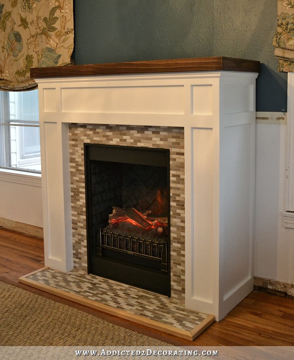 DIY fake fireplace imitating a real one (via www.addicted2decorating.com)