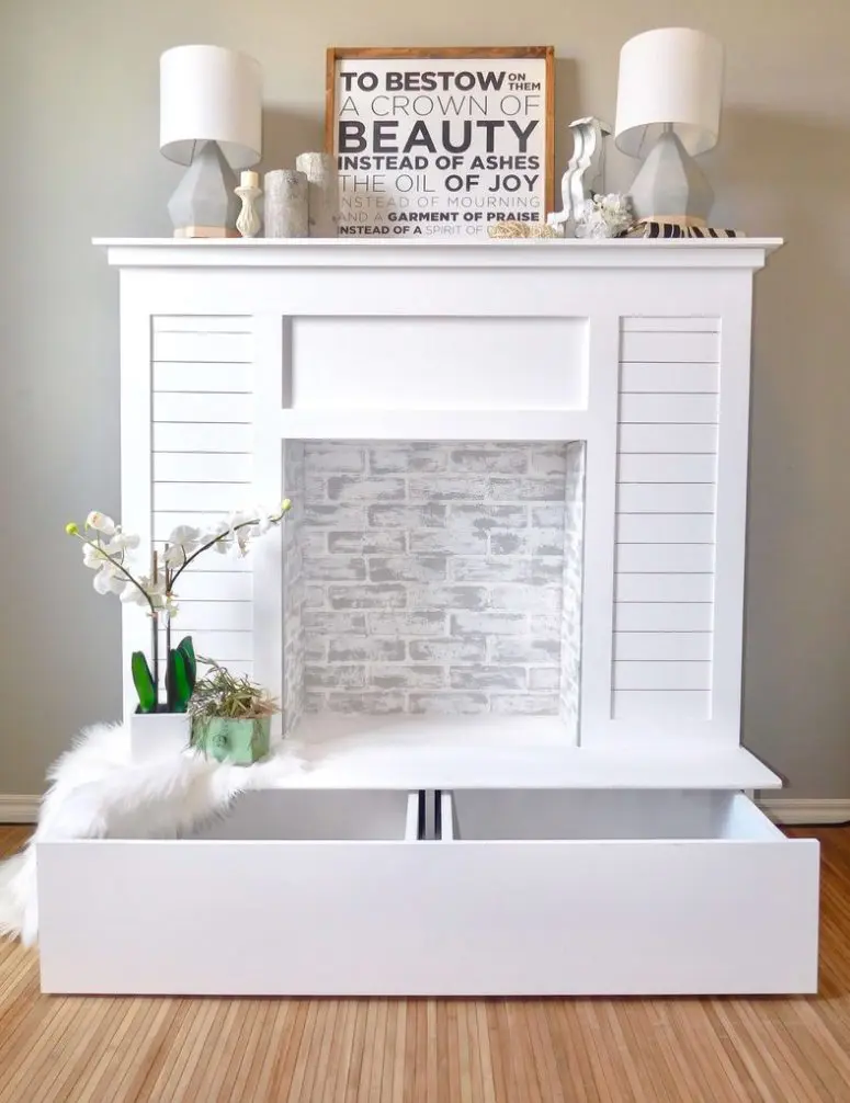 DIY faux fireplace with a large storage drawer (via www.handmade-haven.com)