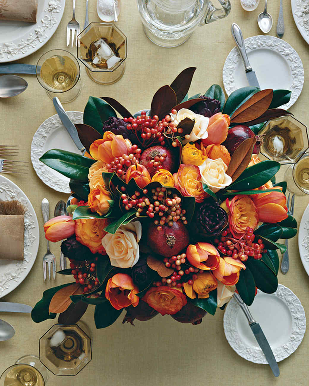 DIY bright centerpiece with pomegranates, tulips and roses