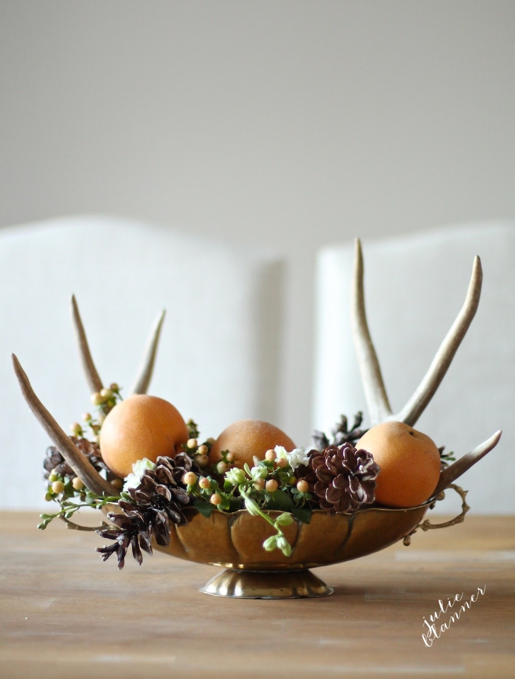 DIY woodland inspired centerpiece with antlers, pinecones and apples