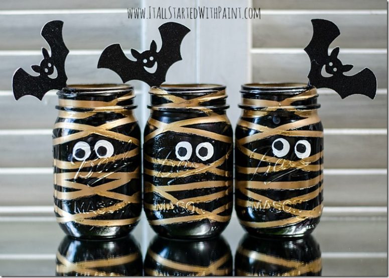 DIY black and gold mummy treat jars with bats (via www.itallstartedwithpaint.com)