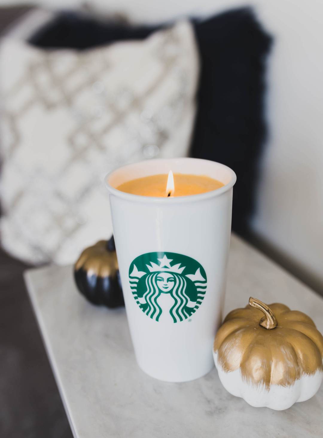 DIY pumpkin spice latte candle in a coffee cup