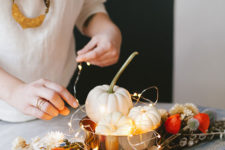 DIY dried blooms and pumpkins in a bowl with LEDs centerpiece