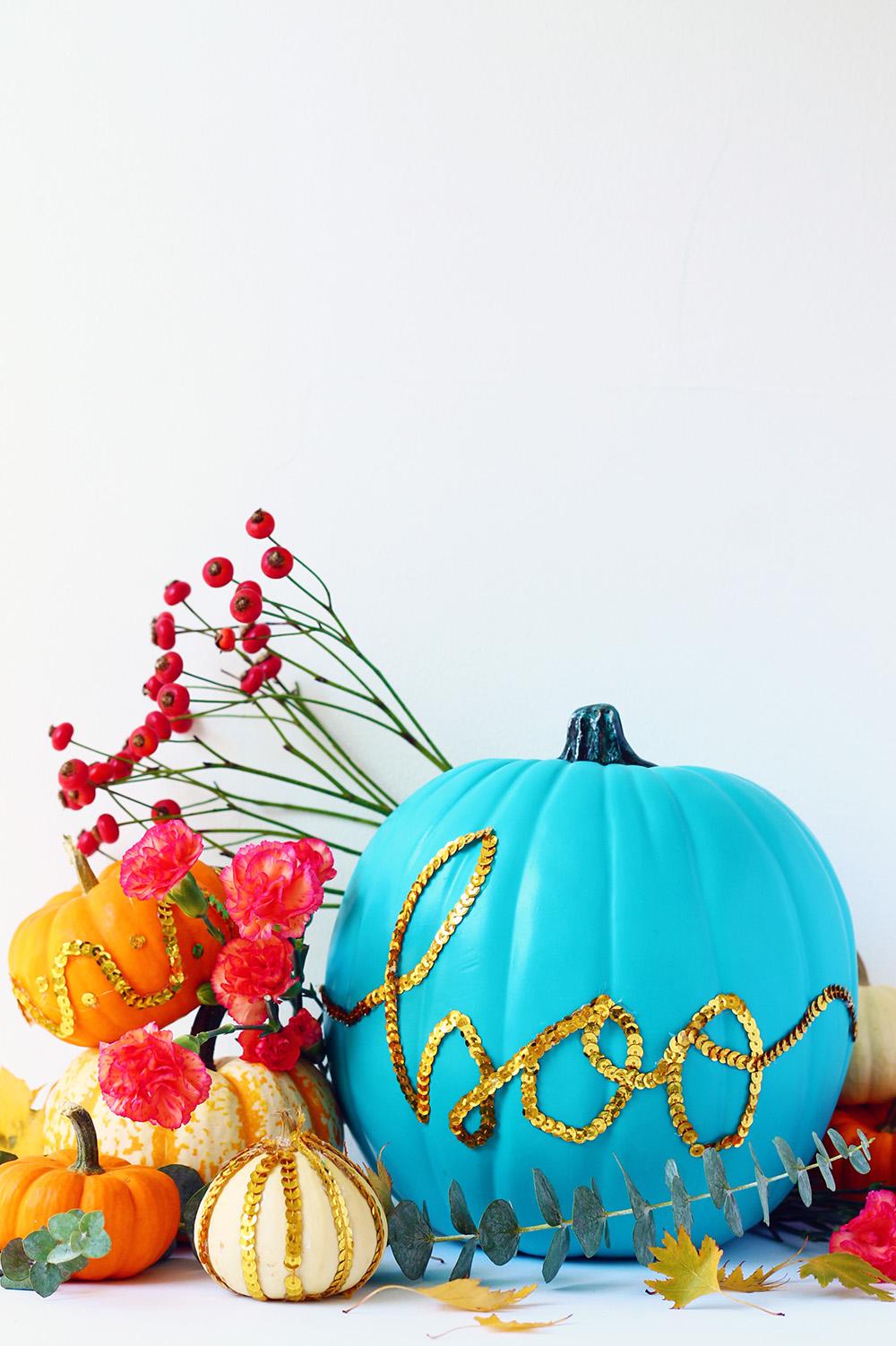 DIY colorful gold sequin trim pumpkins for Halloween (via squirrellyminds.com)