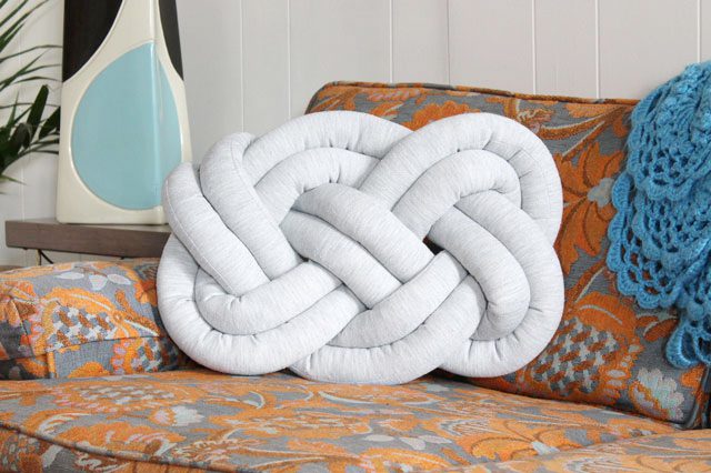 DIY knot pillow of simple grey fabric