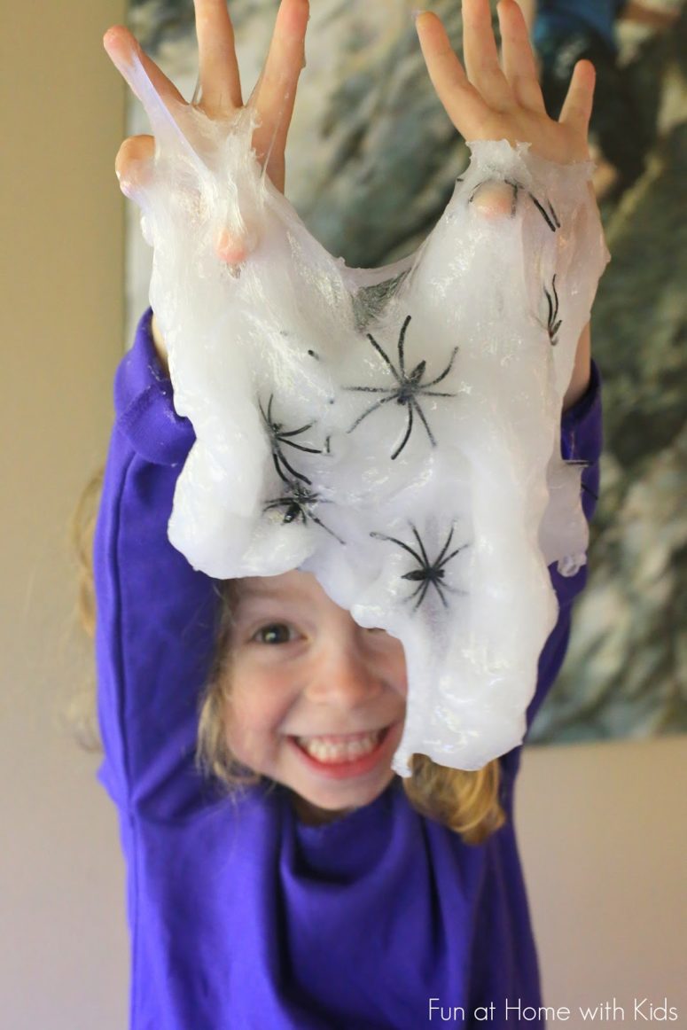 DIY translucent Halloween slime with spiders (via www.funathomewithkids.com)