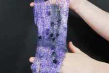 DIY translucent purple glitter slime with spiders