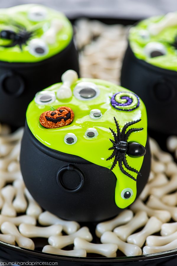 DIY mini cauldrons with slime, spiders and googly eyes (via apumpkinandaprincess.com)