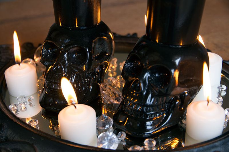 DIY skull votive holders in black for Halloween (via erynwithay.typepad.com)