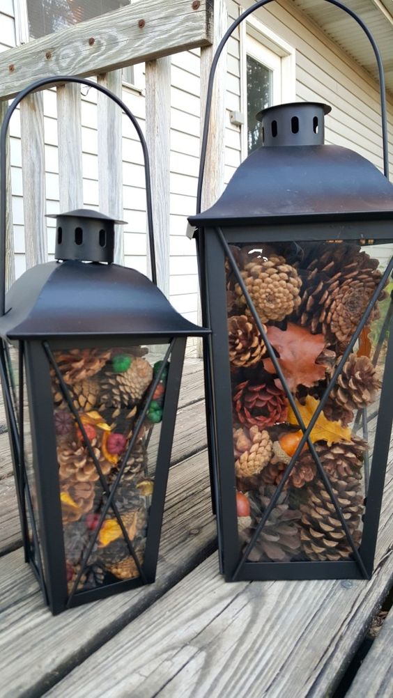 black metal lanterns with pinecones and colorful berries are great for fall and can be nice for winter, too