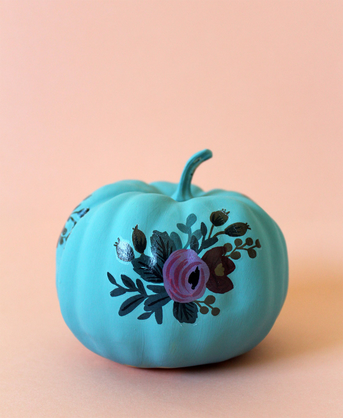 DIY vibrant floral pumpkin with tattoos (via kraftmint.com)