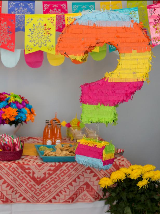 DIY colorful fringe question mark pinata filled with candies (via www.diynetwork.com)
