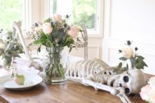 DIY natural Halloween tablescape with a skeleton centerpiece