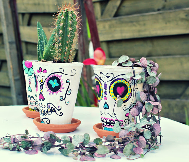 DIY colorful sugar skull planters for Halloween (via sugaranddinosaurs.blogspot.com)