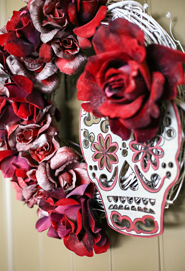DIY deep red sugar skull wreath with fake flowers (via www.kleinworthco.com)