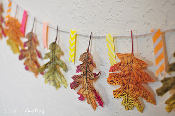DIY washi tape and fall leaf garland (via www.delineateyourdwelling.com)