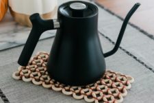 DIY wooden ring trivet mat with colorful yarn