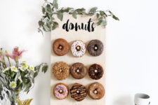 DIY mini donut wall of plywood decorated with eucalyptus