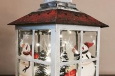 04 a Christmas lantern with a winter scene, snowmen, trees, LEDs and fake snow is adorable