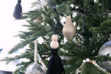 06 a black tassel and wooden bead Christmas tree ornaments are amazing for a touch of boho style