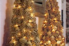 07 a couple of gilded pinecone Christmas trees decorated with lights look very festive and interesting