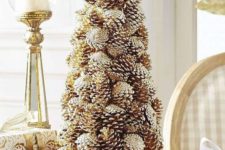 08 a gorgeous gilded pinecone Christmas tree brings both a natural and glam feel to your space