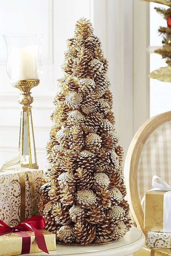 a gorgeous gilded pinecone Christmas tree brings both a natural and glam feel to your space