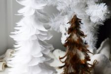 09 a duo of a white and a brown feather Christmas tree next to or under a usual Christmas tree just for fun