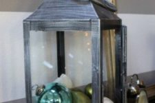11 a shabby chic lantern styled for beach Christmas, with ornaments and shells plus starfish