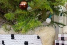 12 a black and white rope Christmas tree collar covered with faux fur
