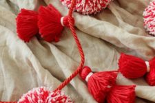 12 color up your holidays with a red and white tassel and pompom garland made for almost nothing