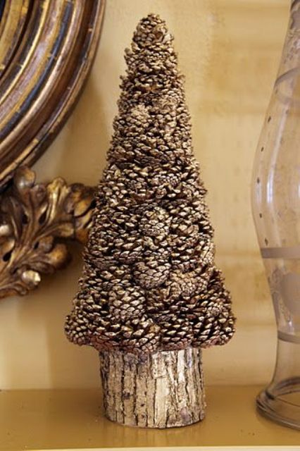 a tree stump underneath is great to highlight the rustic feel and a touch of silver glitter makes the tree sparkly