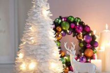 13 a white feather Christmas tree with lights and a colorful ornament wreath with lights are a great combo