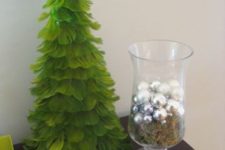 14 paint your feather Christmas tree green to make it look more Christmasssy if you want
